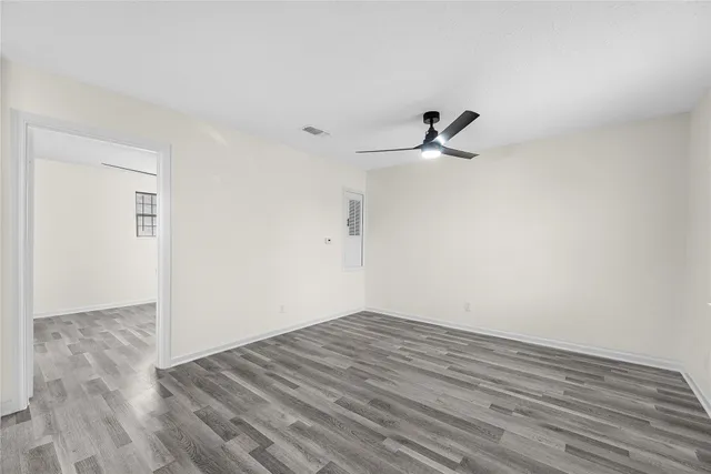 a picture of a bench in front of a wall