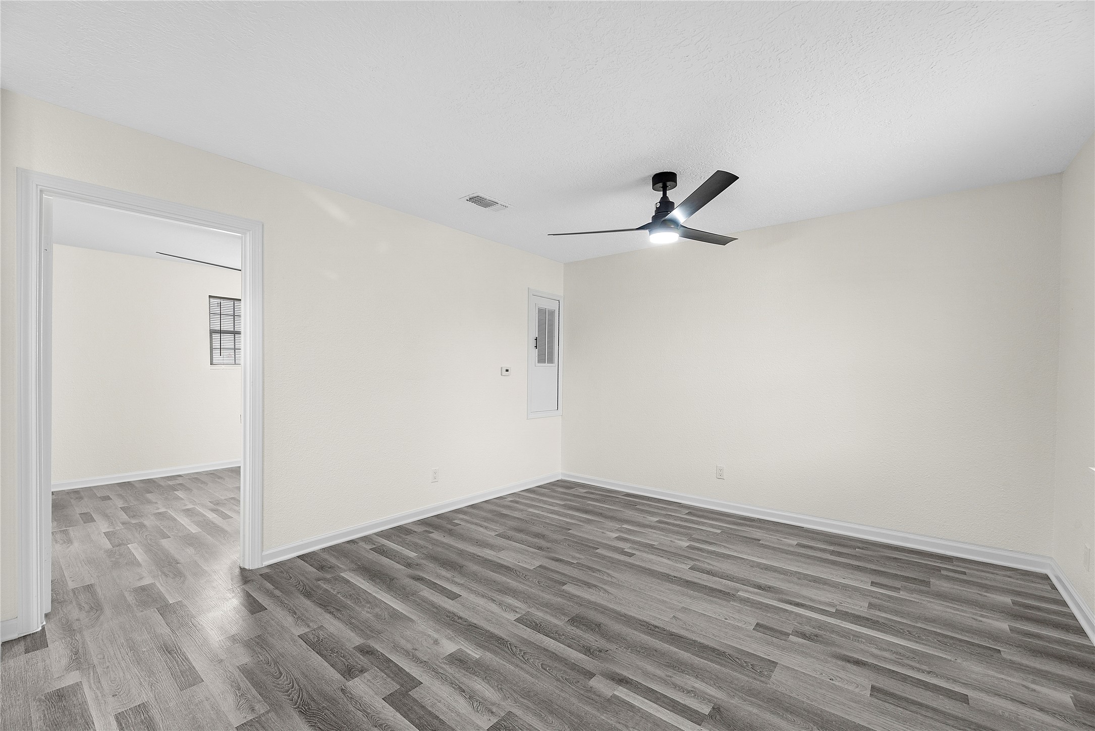 7614 Grahamcrest Drive, Unit 2 Houston, TX 77061 - Photo 7 of 9 a view of empty room with wooden floor