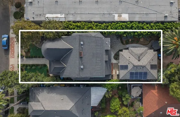an aerial view of houses with outdoor space