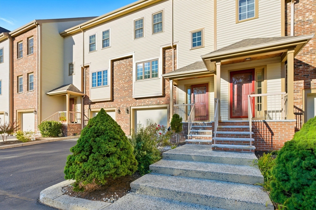 a front view of a multi story residential apartment building