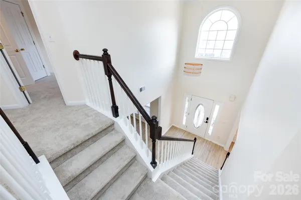 a view of an entryway with wooden floor