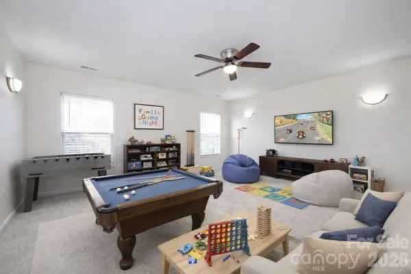 a view of a workspace with furniture and a potted plant
