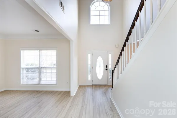 a view of staircase with wooden floor and staircase
