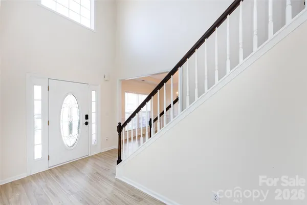 a view of staircase with wooden floor and staircase