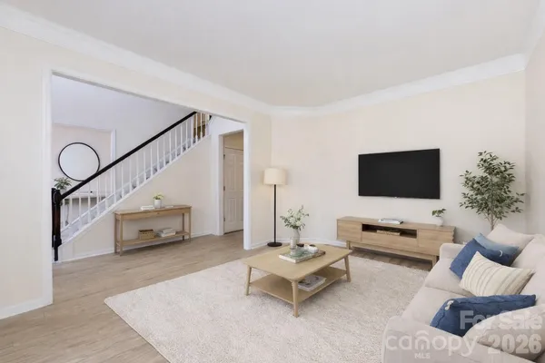 a living room with furniture and a flat screen tv