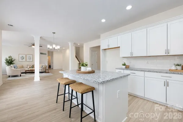 a kitchen with sink and cabinets
