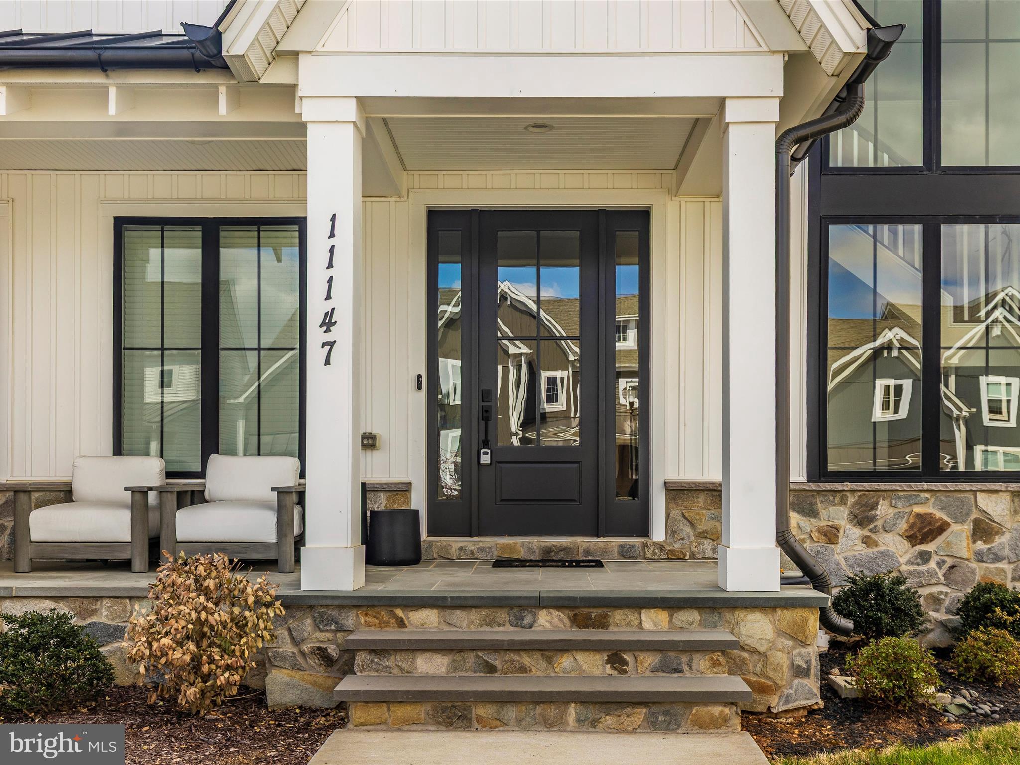 11147 Hazelnut Lane Monrovia, MD 21770 - Photo 2 of 66 a front view of a house with a garden
