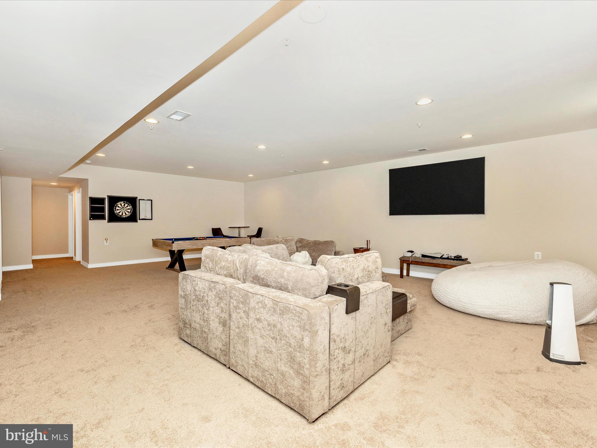 11147 Hazelnut Lane Monrovia, MD 21770 - Photo 37 of 66 a living room with furniture and a flat screen tv