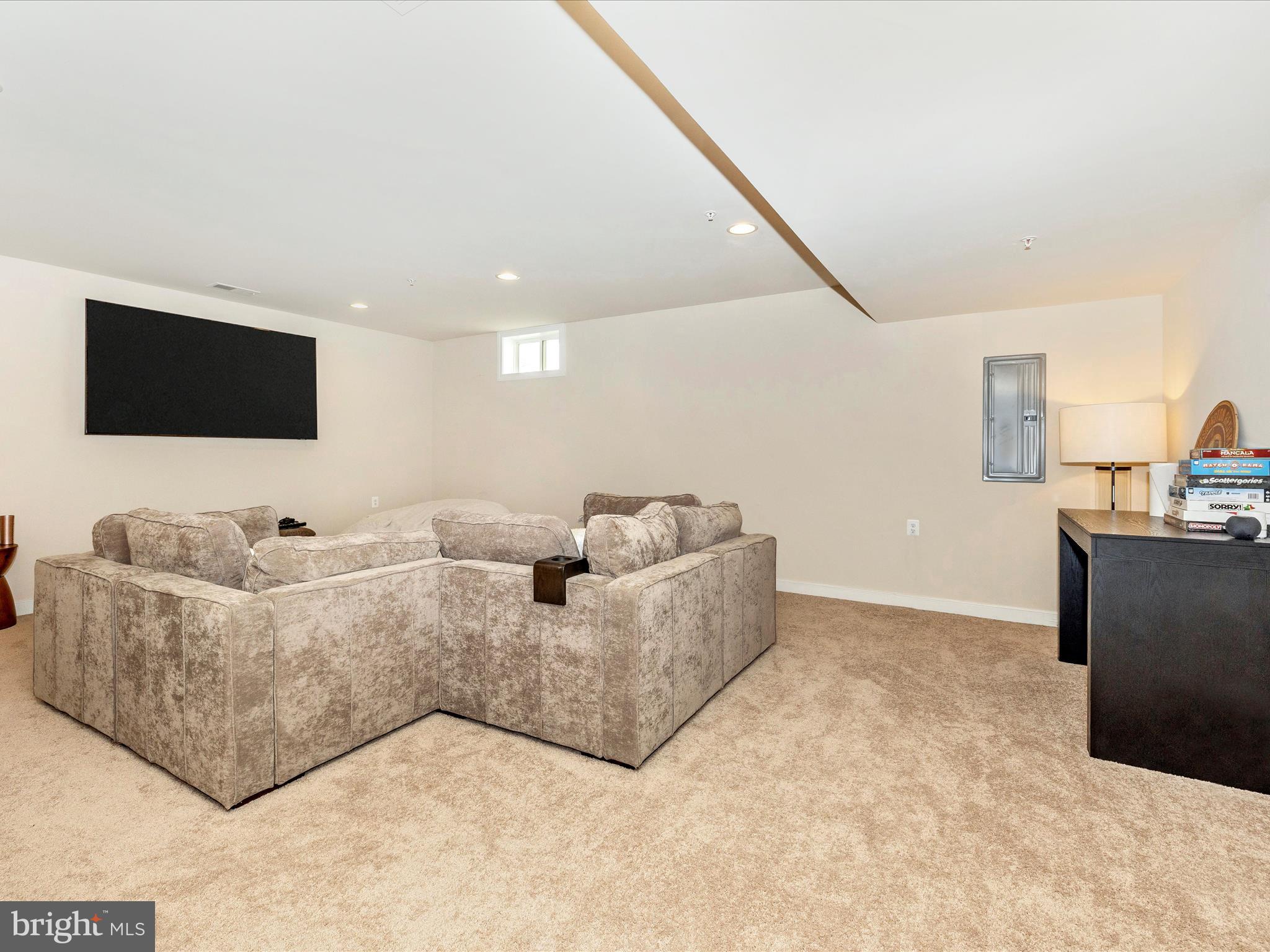 11147 Hazelnut Lane Monrovia, MD 21770 - Photo 38 of 66 a living room with furniture and a flat screen tv