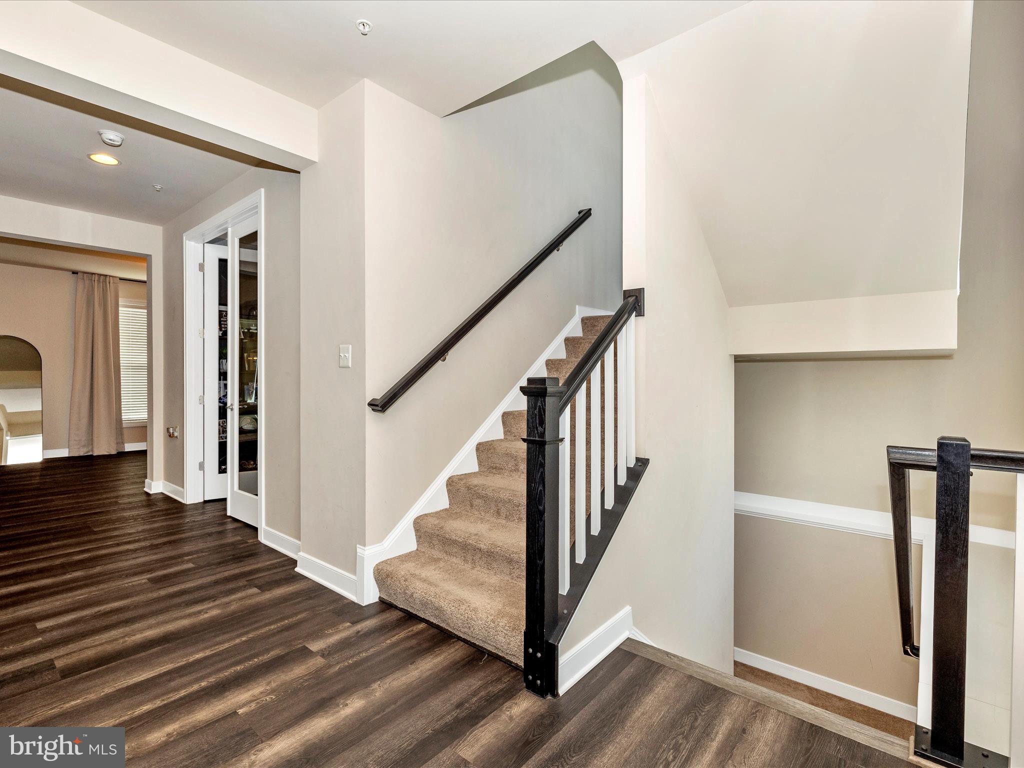 11147 Hazelnut Lane Monrovia, MD 21770 - Photo 4 of 66 a view of a hallway with wooden floor and staircase