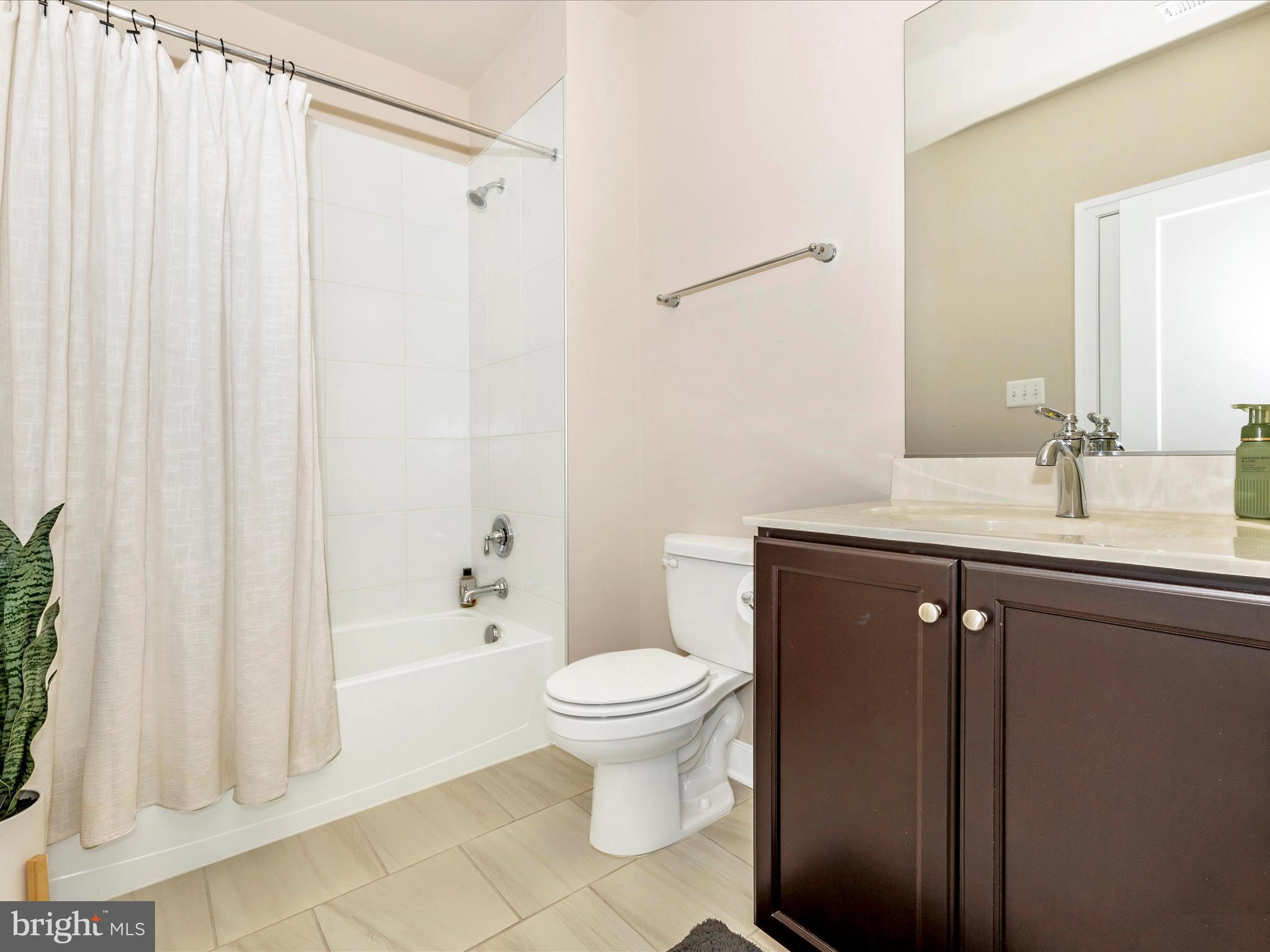 11147 Hazelnut Lane Monrovia, MD 21770 - Photo 41 of 66 a bathroom with a granite countertop sink toilet and shower