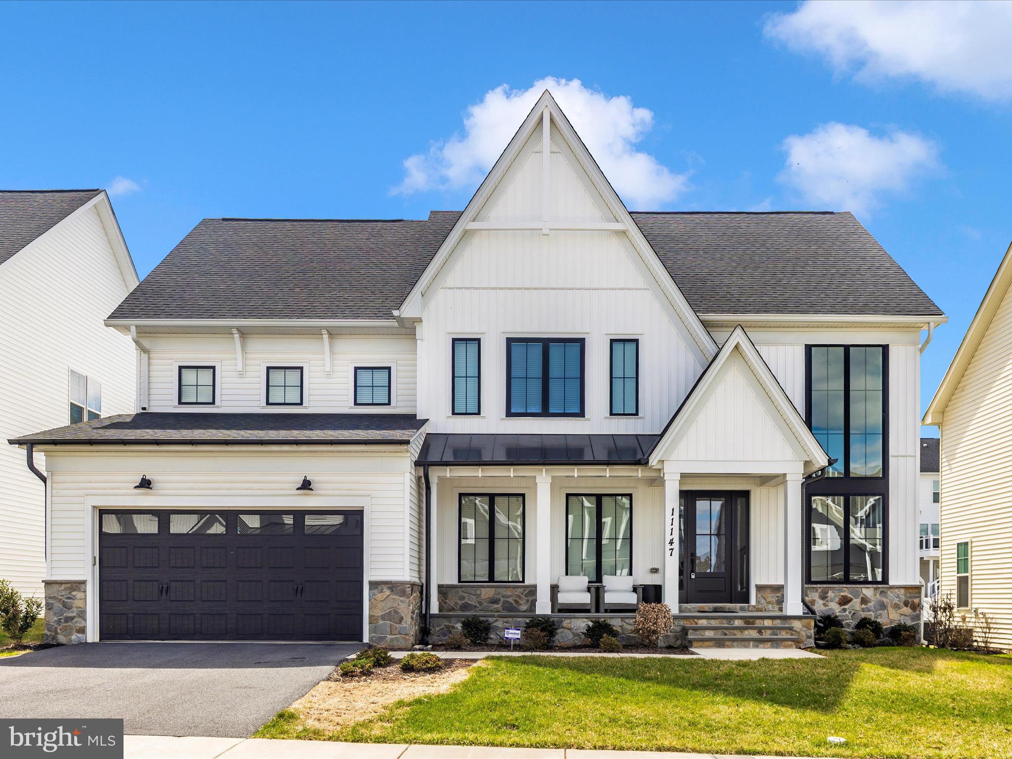 11147 Hazelnut Lane Monrovia, MD 21770 - Photo 42 of 66 a view of a white house with swimming pool in front of it