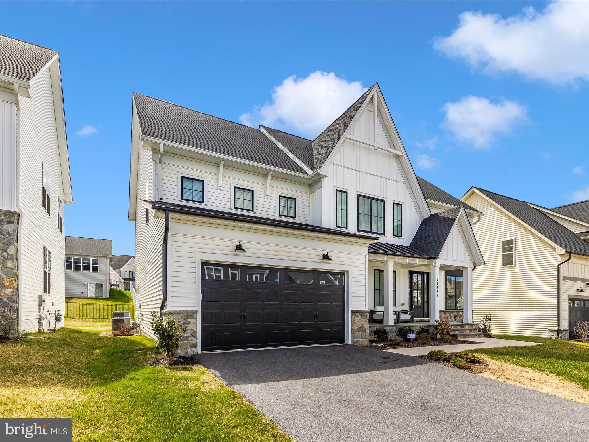 11147 Hazelnut Lane Monrovia, MD 21770 - Photo 43 of 66 a view of a house with many windows and yard