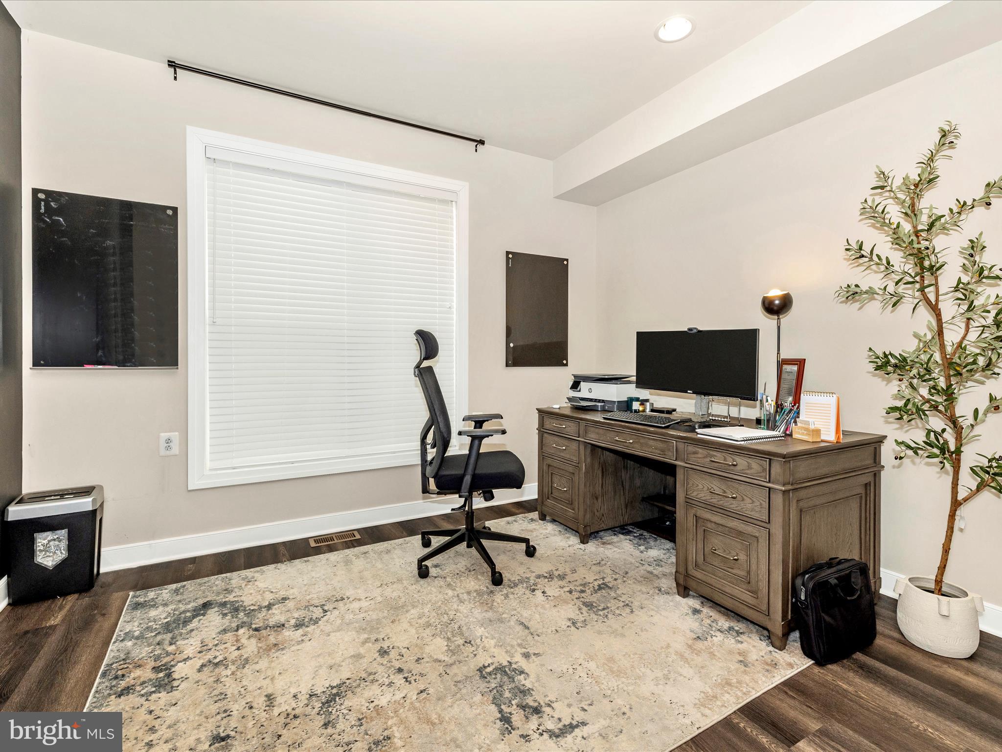 11147 Hazelnut Lane Monrovia, MD 21770 - Photo 5 of 66 a view of a workspace with furniture and a flat screen tv