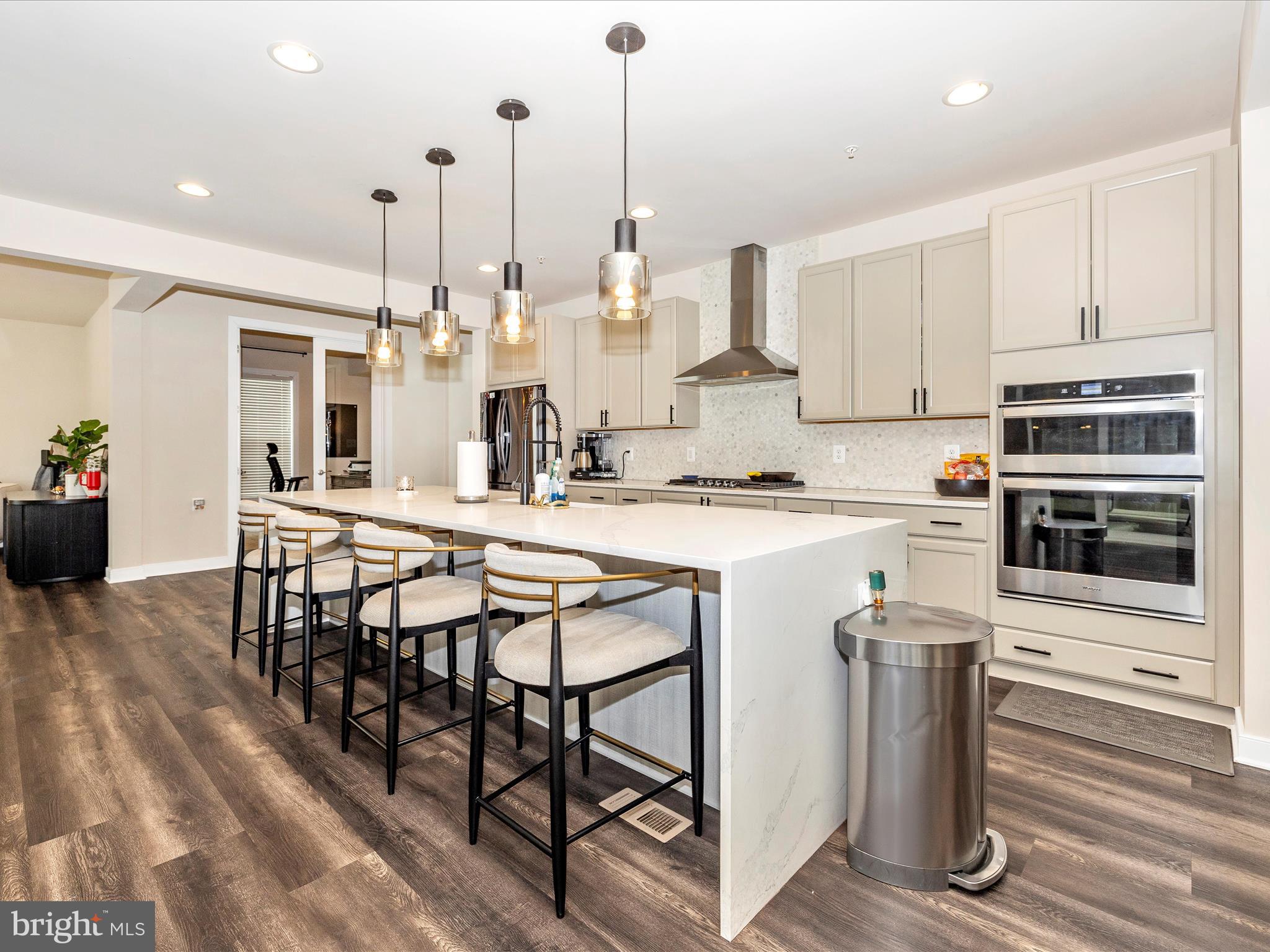 11147 Hazelnut Lane Monrovia, MD 21770 - Photo 8 of 66 a kitchen with stainless steel appliances kitchen island granite countertop a stove a sink and a refrigerator
