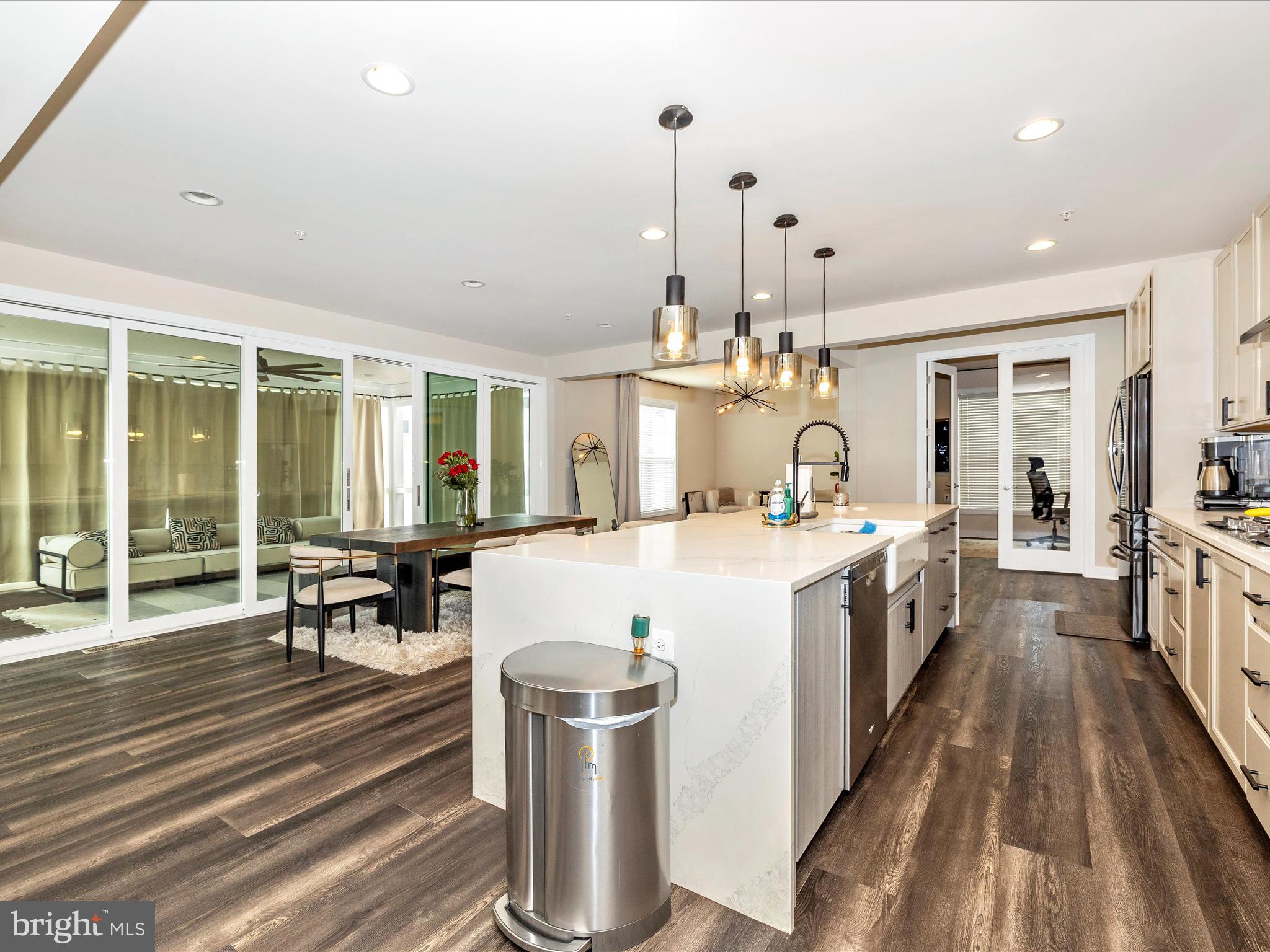 11147 Hazelnut Lane Monrovia, MD 21770 - Photo 9 of 66 a large white kitchen with sink and dishwasher a stove with wooden floor