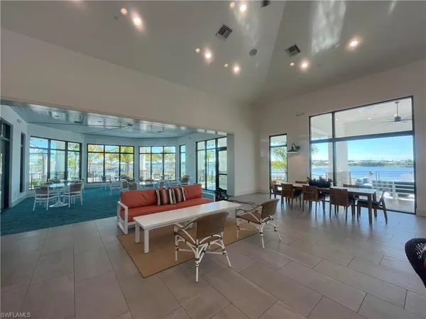 a bathroom with a double vanity sink a mirror and a bathtub