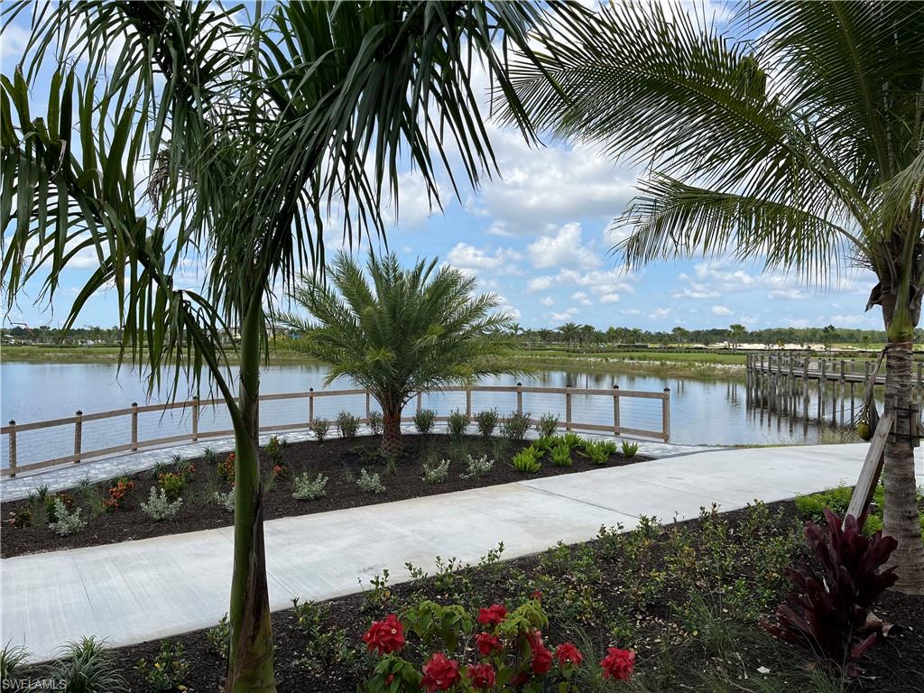 4580 Centaurus Circle Naples, FL 34120 - Photo 23 of 25 a view of a terrace with palm trees