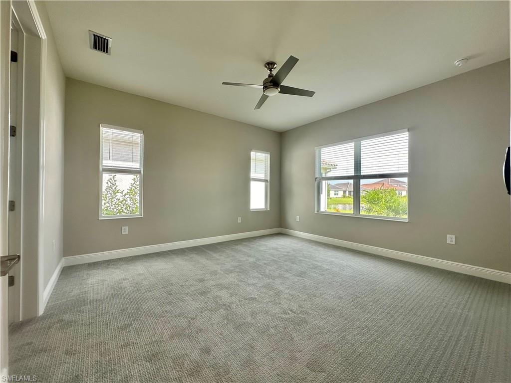 4580 Centaurus Circle Naples, FL 34120 - Photo 6 of 25 a view of an empty room with a window