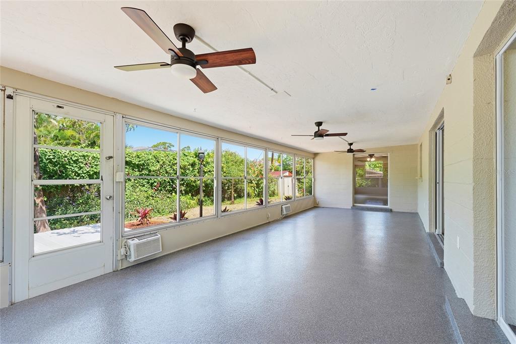 5984 Diana Road Venice, FL 34293 - Photo 19 of 36 an empty room with windows and outdoor view