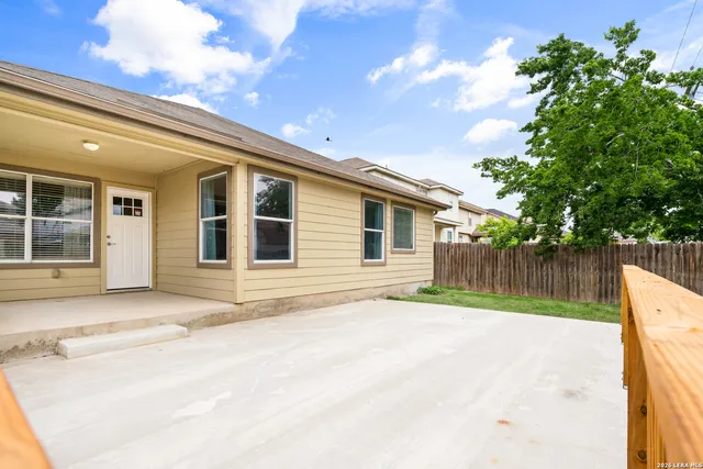 a view of a backyard of the house