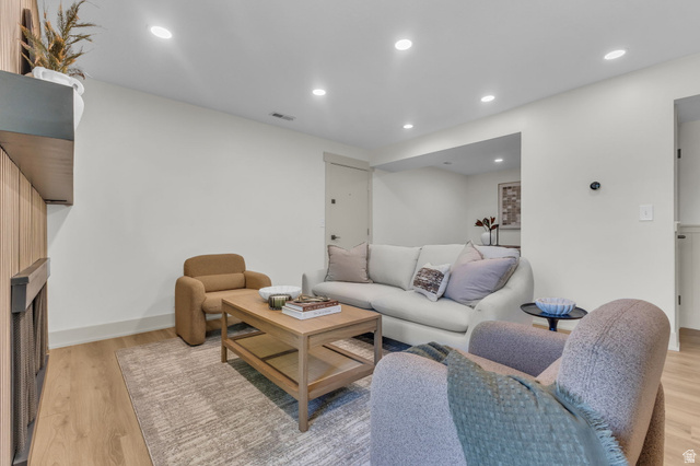 88 West 50 South, Unit C8 Centerville, UT 84014 - Photo 4 of 29 Inviting living area featuring wood-finish flooring, recessed lighting, and crisp white walls