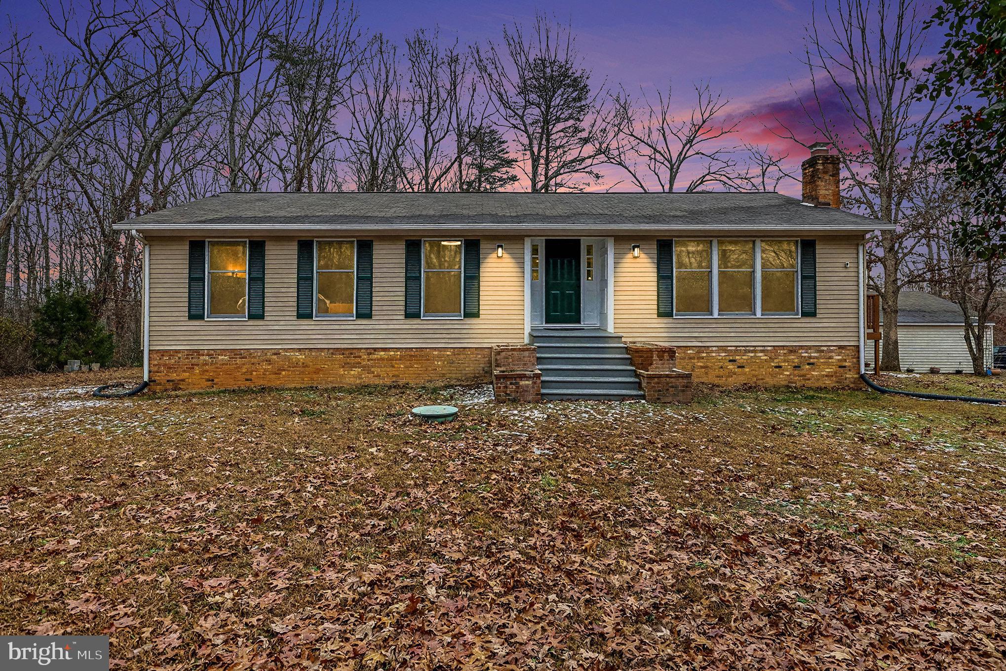 front view of a house with a yard