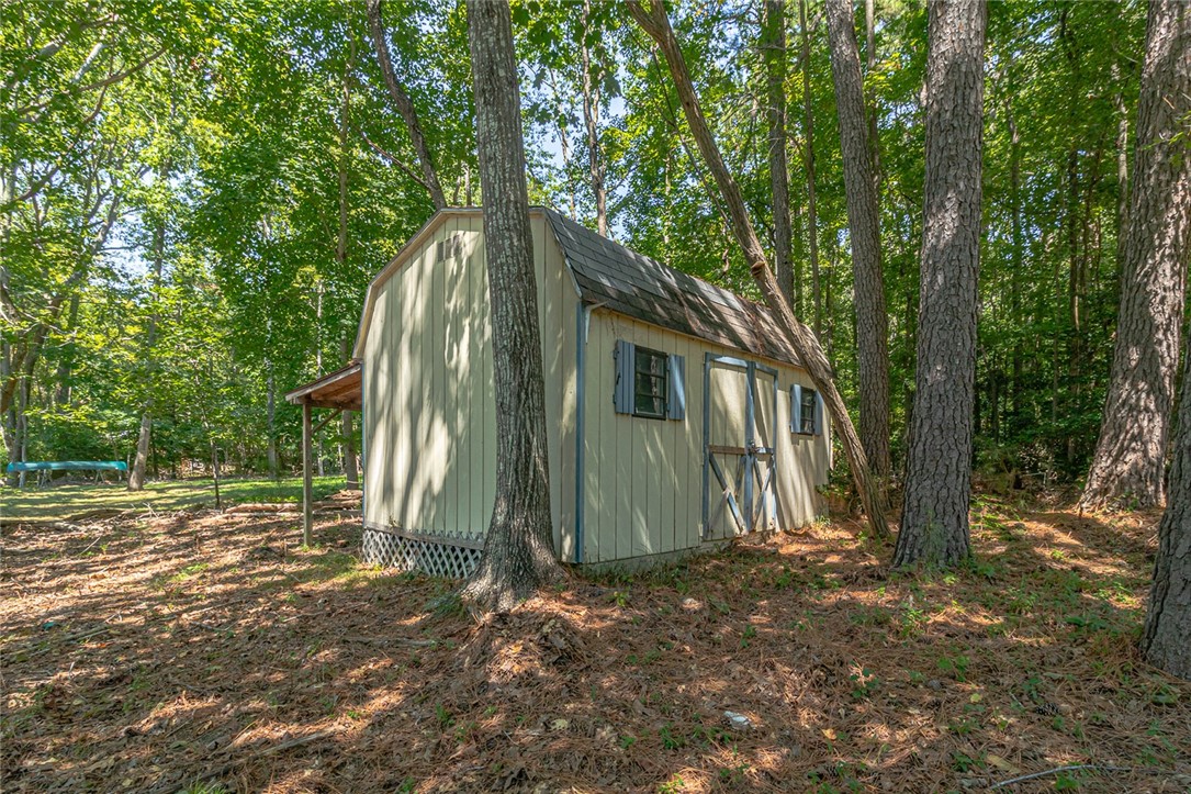 148 Denver Road Heathsville, VA 22473 - Photo 44 of 50 View of shed with view of wooded area