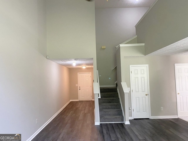 646 Lakes Circle Lithonia, GA 30058 - Photo 14 of 32 a view of a hallway with wooden floor