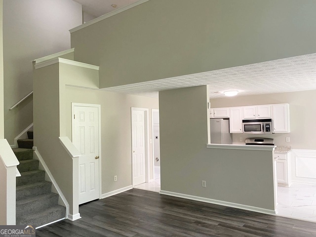 646 Lakes Circle Lithonia, GA 30058 - Photo 15 of 32 a view of kitchen with wooden floor and electronic appliances