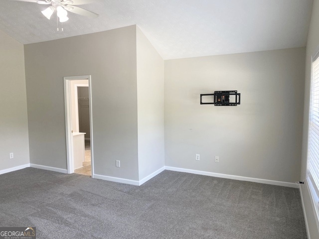 646 Lakes Circle Lithonia, GA 30058 - Photo 19 of 32 an empty room with a view of bathroom
