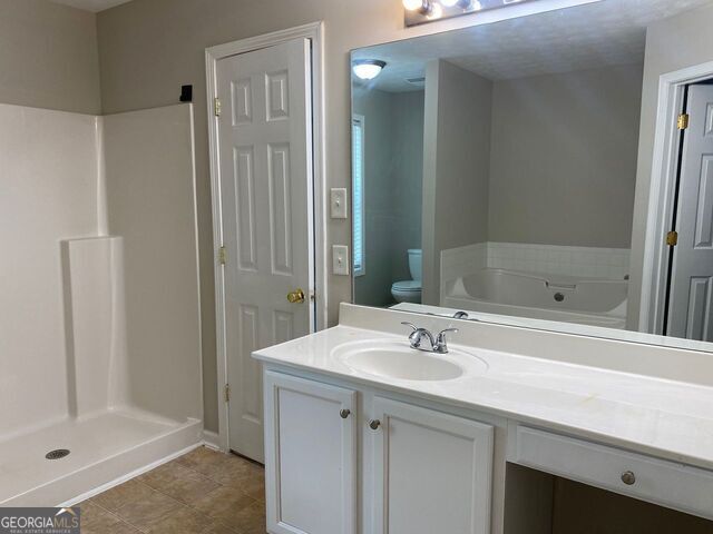 646 Lakes Circle Lithonia, GA 30058 - Photo 21 of 32 a bathroom with a sink a shower and a mirror