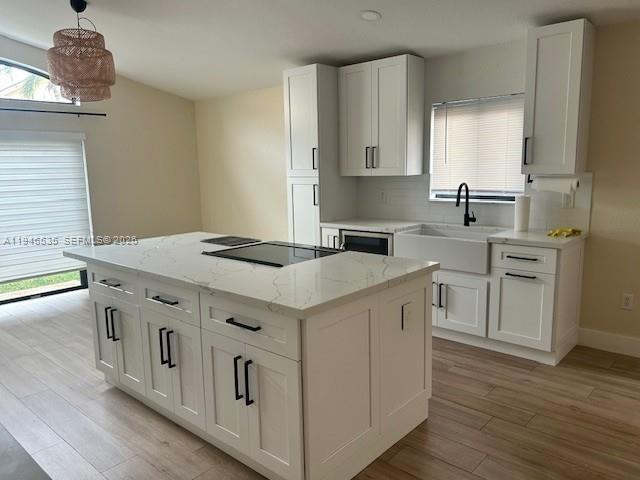 1924 Southeast 11th Street Homestead, FL 33035 - Photo 12 of 21 a kitchen with stainless steel appliances granite countertop a sink and dishwasher a stove with wooden floor