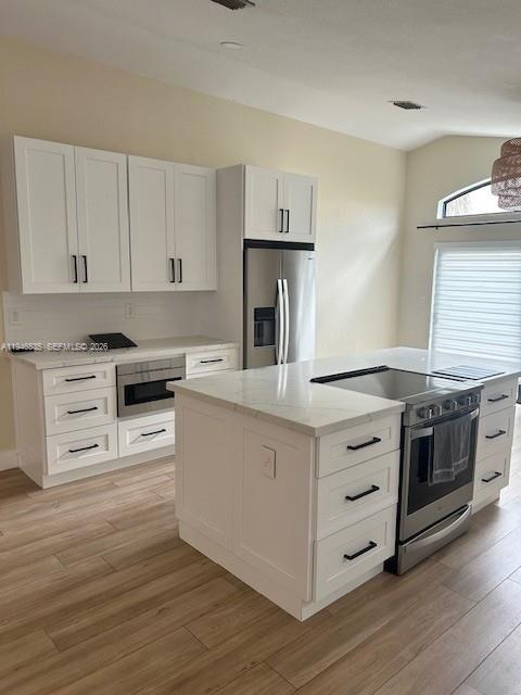 1924 Southeast 11th Street Homestead, FL 33035 - Photo 13 of 21 a kitchen with granite countertop white cabinets and stainless steel appliances