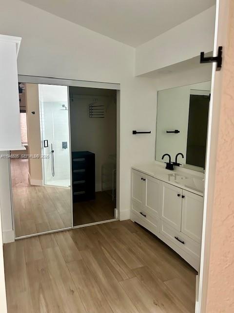 1924 Southeast 11th Street Homestead, FL 33035 - Photo 17 of 21 a bathroom with a double vanity sink and mirror