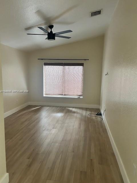 1924 Southeast 11th Street Homestead, FL 33035 - Photo 19 of 21 wooden floor in an empty room with a window