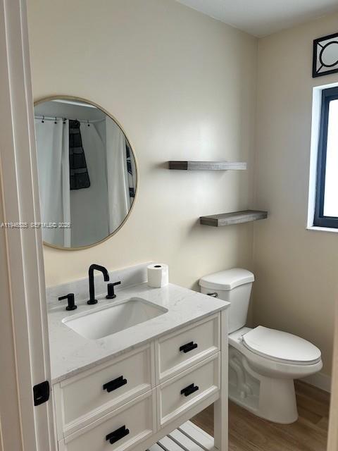 1924 Southeast 11th Street Homestead, FL 33035 - Photo 5 of 21 a bathroom with a toilet sink and mirror
