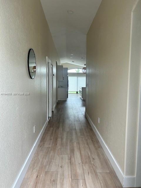 1924 Southeast 11th Street Homestead, FL 33035 - Photo 7 of 21 a view of a hallway with wooden floor