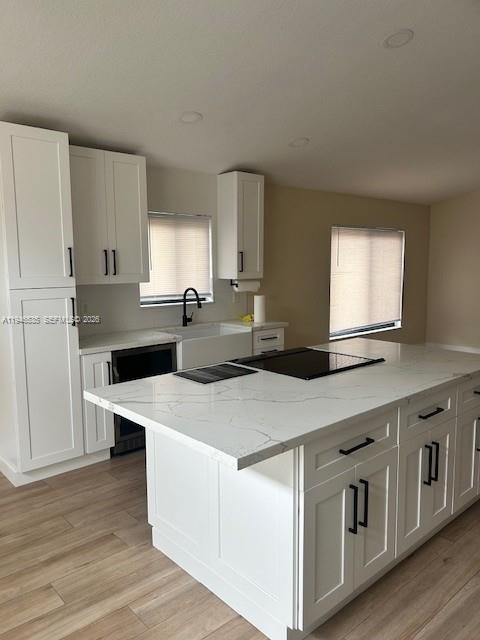 1924 Southeast 11th Street Homestead, FL 33035 - Photo 8 of 21 a kitchen with stainless steel appliances kitchen island a white cabinets sink and stove