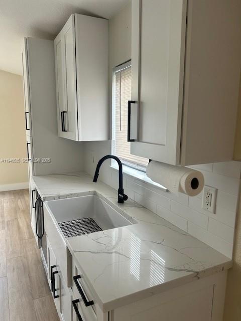 1924 Southeast 11th Street Homestead, FL 33035 - Photo 9 of 21 a kitchen with a sink a microwave and cabinets