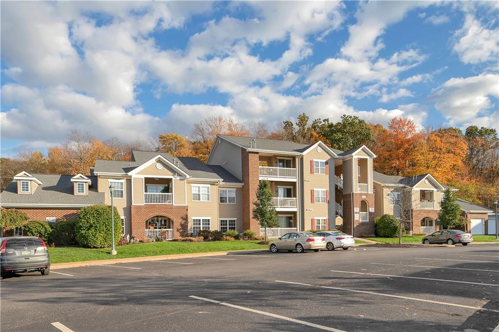 808 Stockton Ridge Cranberry Township, PA 16066 - Photo 1 of 25 a view of a big house with a street and plants