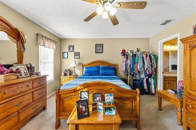 a bedroom with a bed and a walk in closet