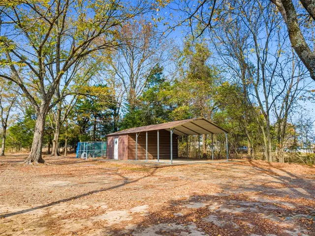 a view of road with large trees