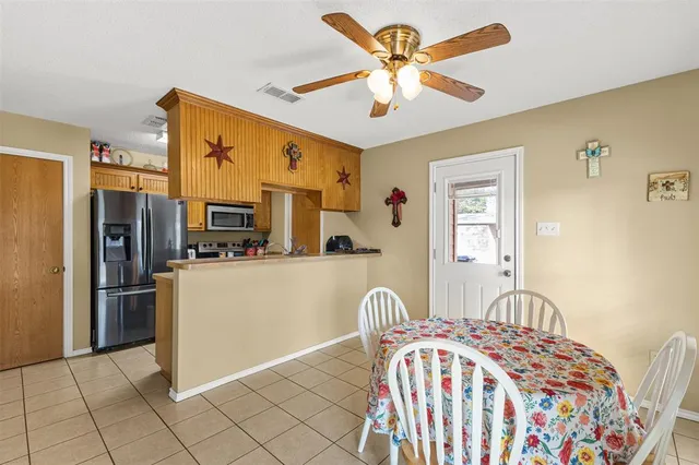 a bedroom with a bed dresser and a window