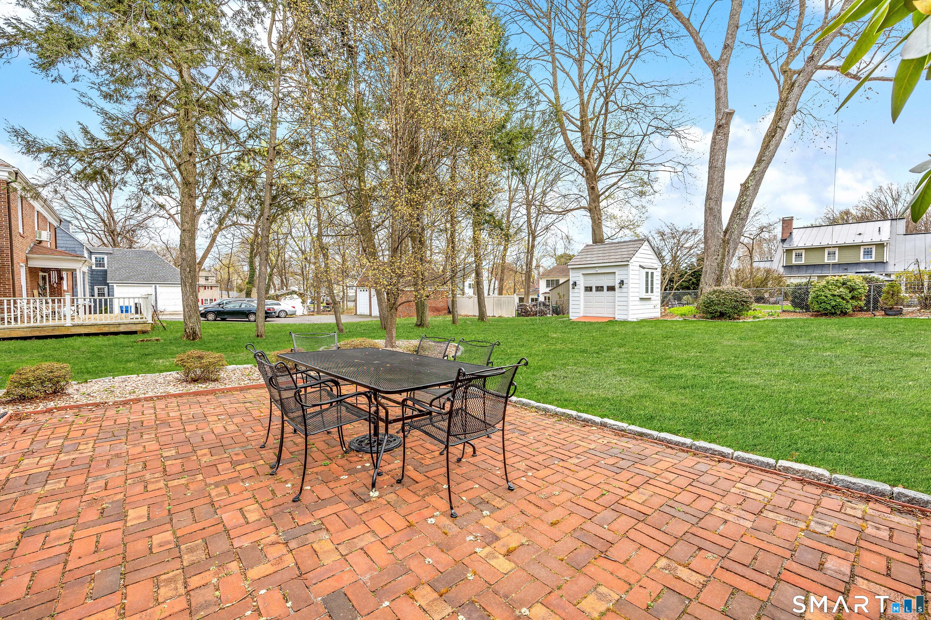 40 10 Acre Road New Britain, CT 06052 - Photo 37 of 38 a backyard of a house with outdoor seating