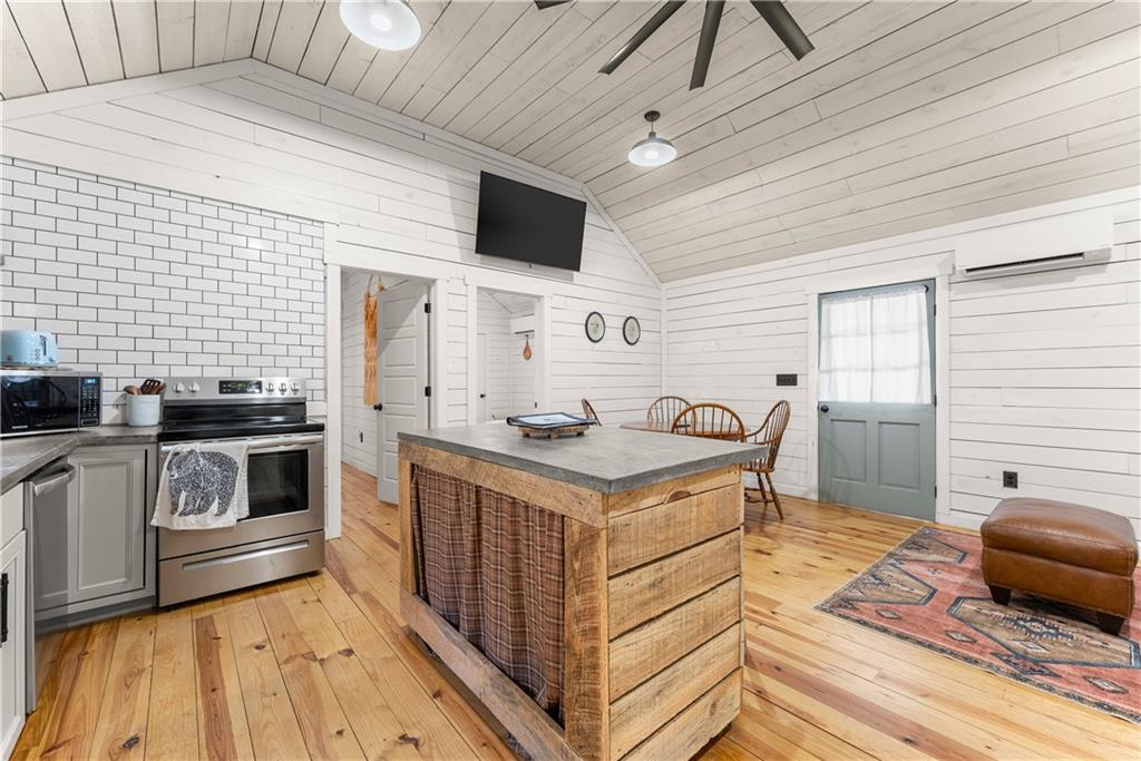 121 Waterfalls Way Clarkesville, GA 30523 - Photo 21 of 60 a kitchen with a stove and a sink