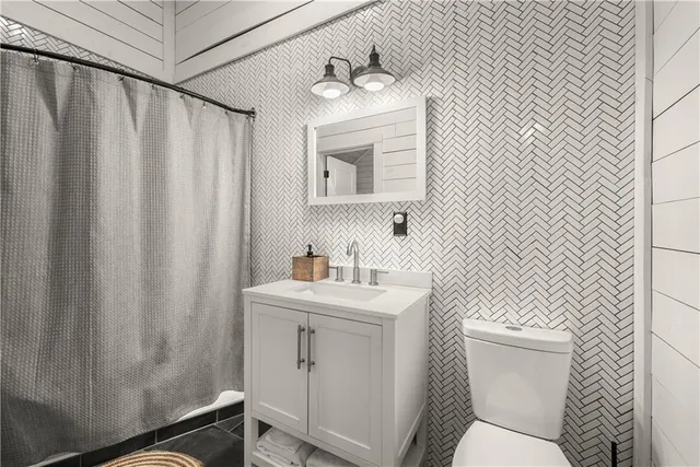 a view of living room with furniture and a rug