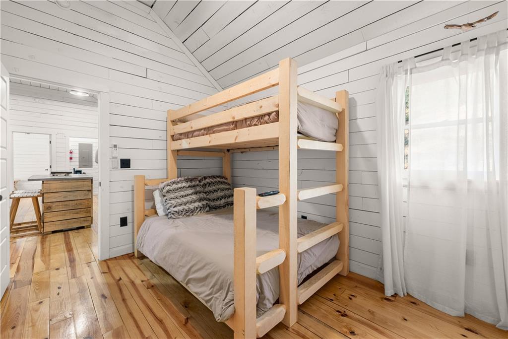 121 Waterfalls Way Clarkesville, GA 30523 - Photo 32 of 60 a bedroom with a bed and a window