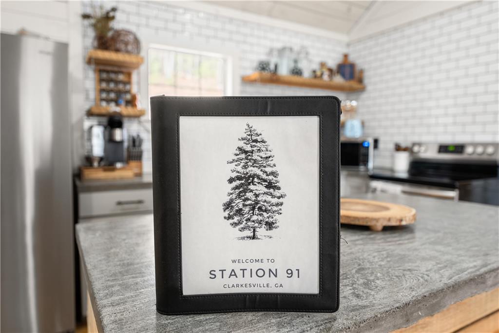 121 Waterfalls Way Clarkesville, GA 30523 - Photo 34 of 60 a view of living room with furniture and a rug
