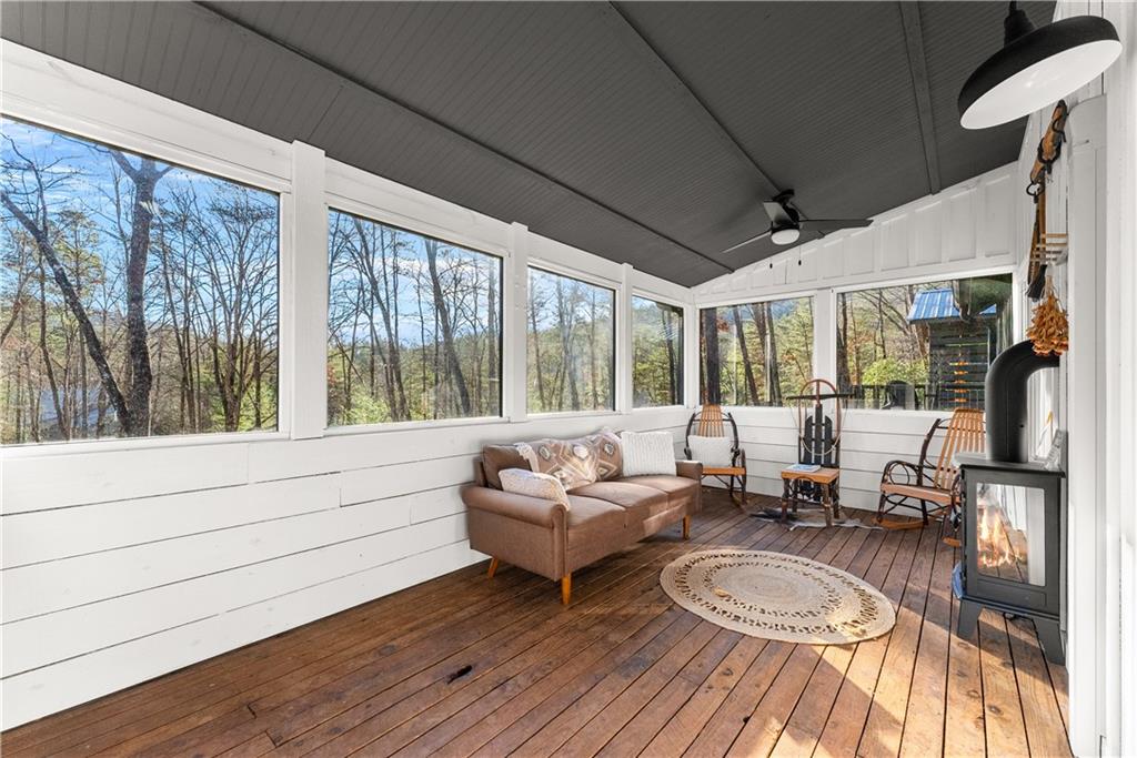 121 Waterfalls Way Clarkesville, GA 30523 - Photo 35 of 60 a living room with furniture and a large window